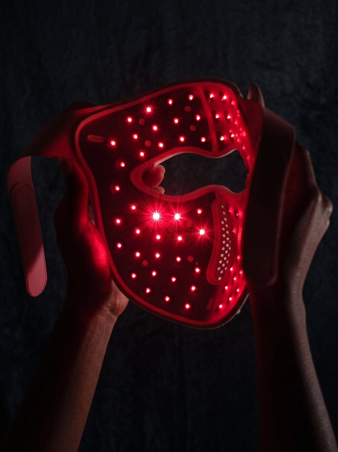 Helia held up with its red light on, seen from the inside.
